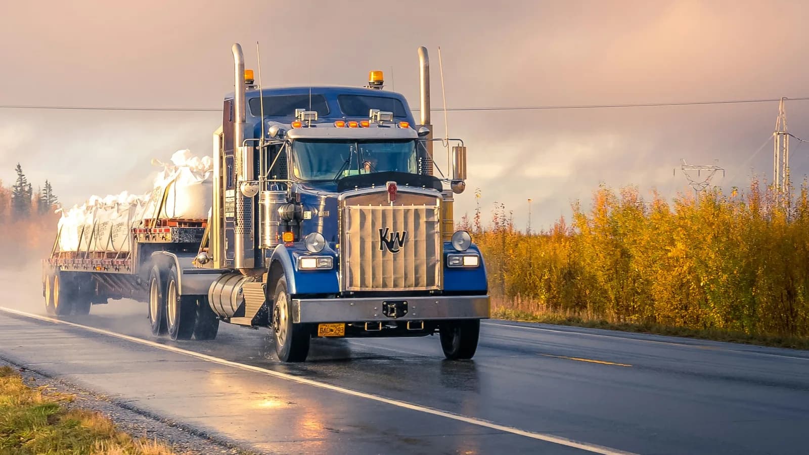Flatbed truck hauling freight on a highway