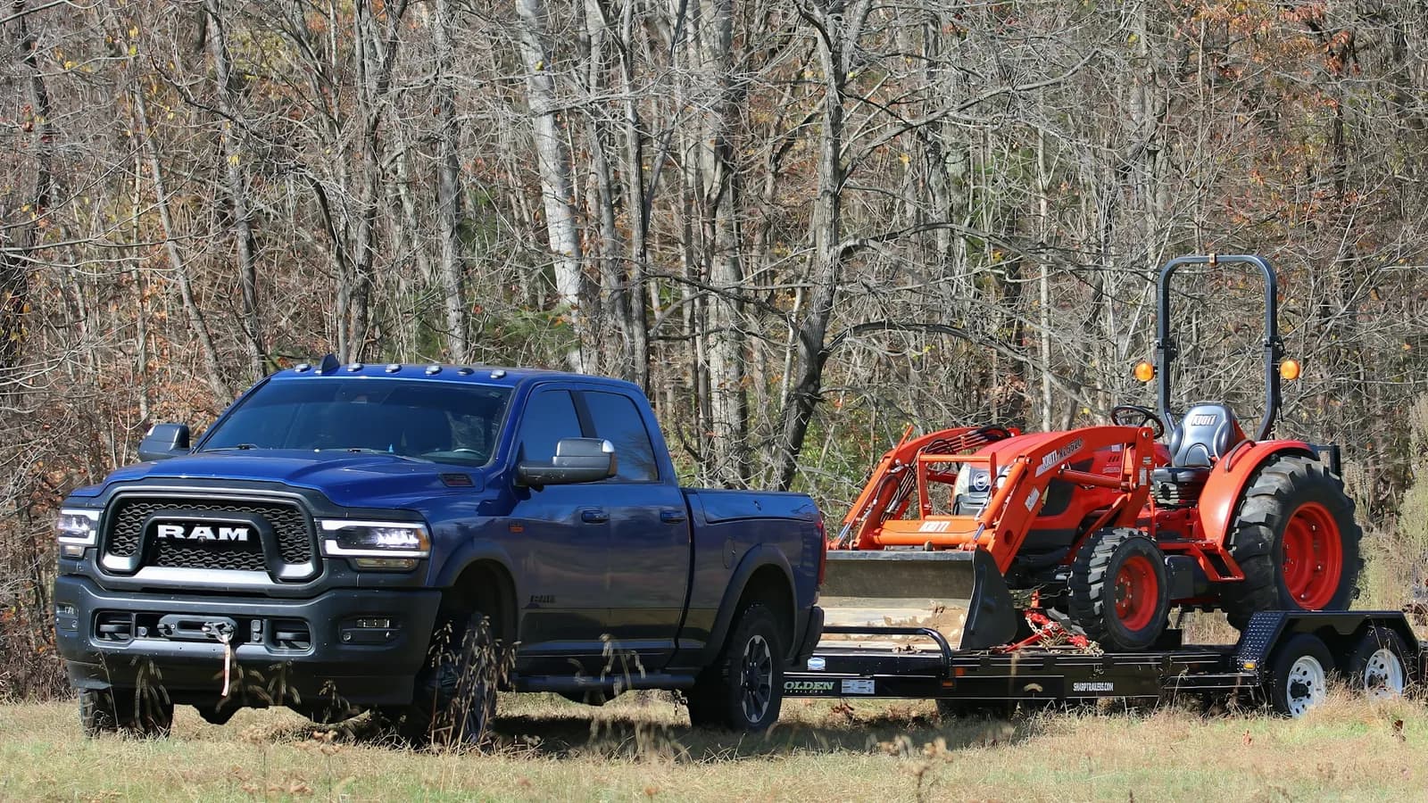 Heavy-duty pickup hauling equipment on a trailer